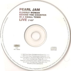 Elderly Woman Behind the Counter in a Small Town