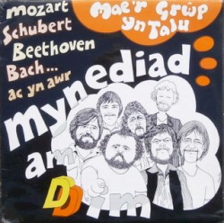 Mae’r Grŵp Yn Talu