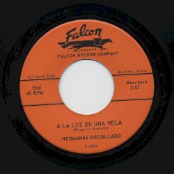 A la luz de una vela / Tres clavos negros