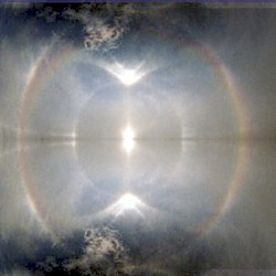 each raindrop is a sphere (that scatters light over the sky)