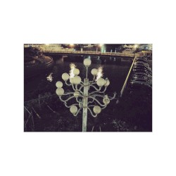 Umbrellas adorning a bridge