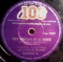 Tres Monedas En La Fuente / Lluvia