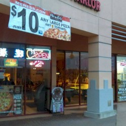 Hilltop Plaza and a Gas Station at Dusk